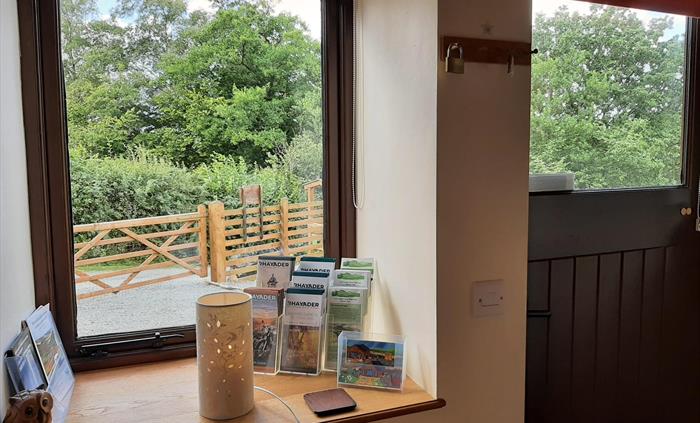 Ash Lodge and Sycamore Lodge entrance hall with coat hanging space and welcome leaflets.